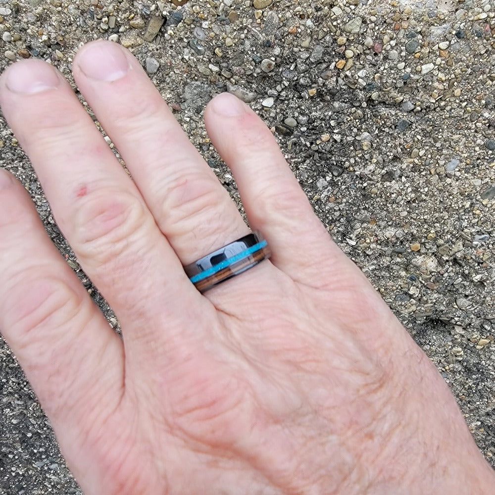 8mm Black Ceramic Band with Turquoise and Bourbon Barrel Inlay on hand
